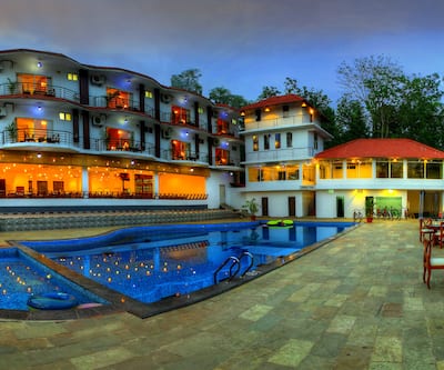 https://imgcld.yatra.com/ytimages/image/upload/t_hotel_yatra_city_desktop/v1460351607/Domestic Hotels/Hotels_Coorg/Paddington Resort/pool.jpg